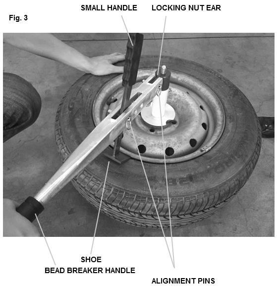 Note: The tire is first assembled to the hub holder in an inverted position, with the valve stem down. 4. Thread the locking nut onto the threaded shaft and tighten.