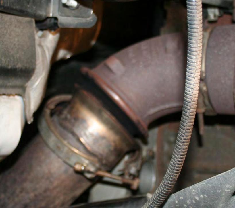 Remove the passenger side inner fender well