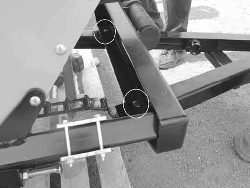 29. Attach hitch at the front location on the spreader with (2) Carriage Bolt, 1/2NC x