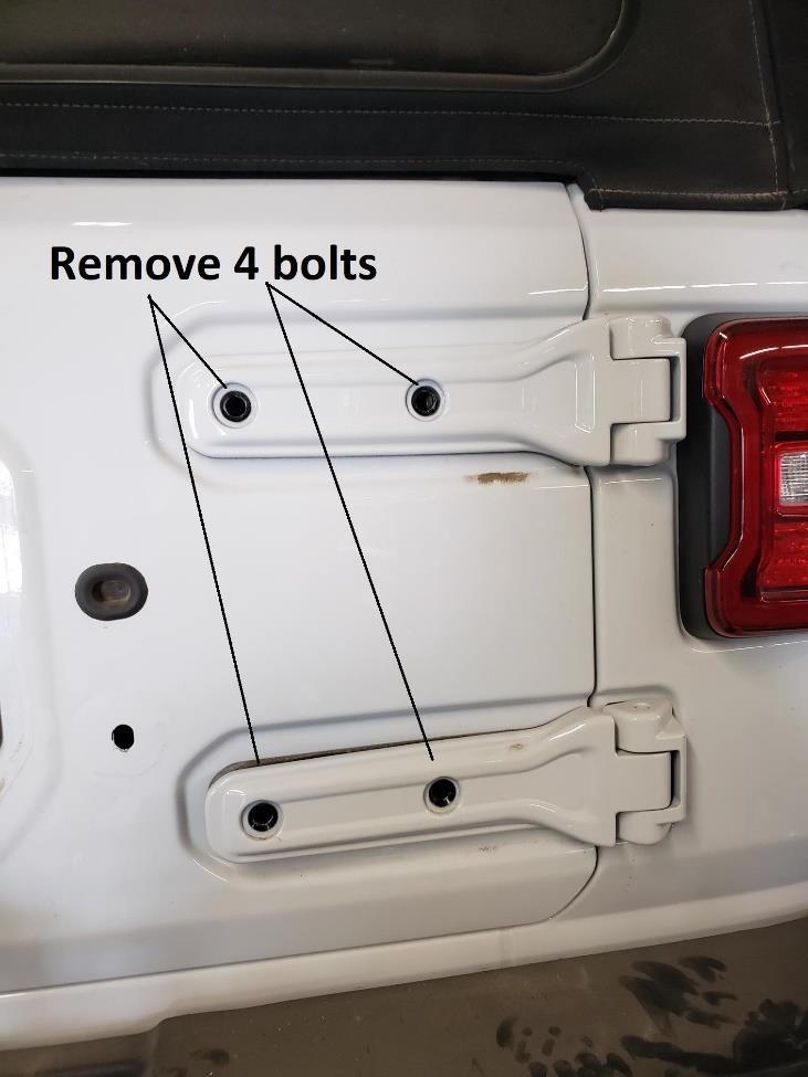 17. With tailgate closed and rear window open, using a Torx Bit (T55) remove the 2 bolts holding the hinges to tailgate,