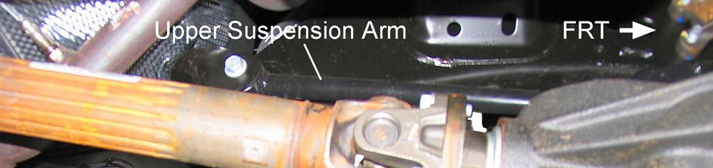 5) Remove the shock absorber upper nut, retainer, and bushing. 6) Remove the shock absorber lower nut and bolt.