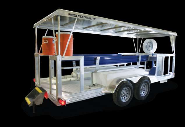 It features two bench seats that run the length of the trailer, a canopy roof and water tanks.