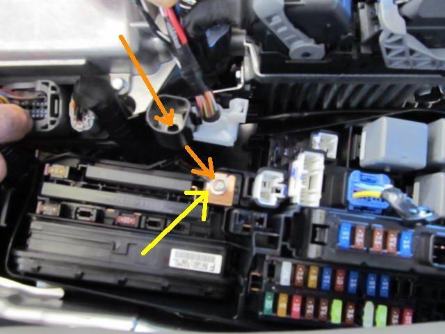 (Hybrid) Place the red ring terminal of the fog light wire harness in the positive terminal