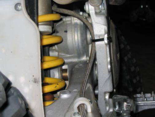 Remove foot actuator, master cylinder, and attached brake line, as they will no longer be used. 10. Utilize the existing rear brake line retainers.