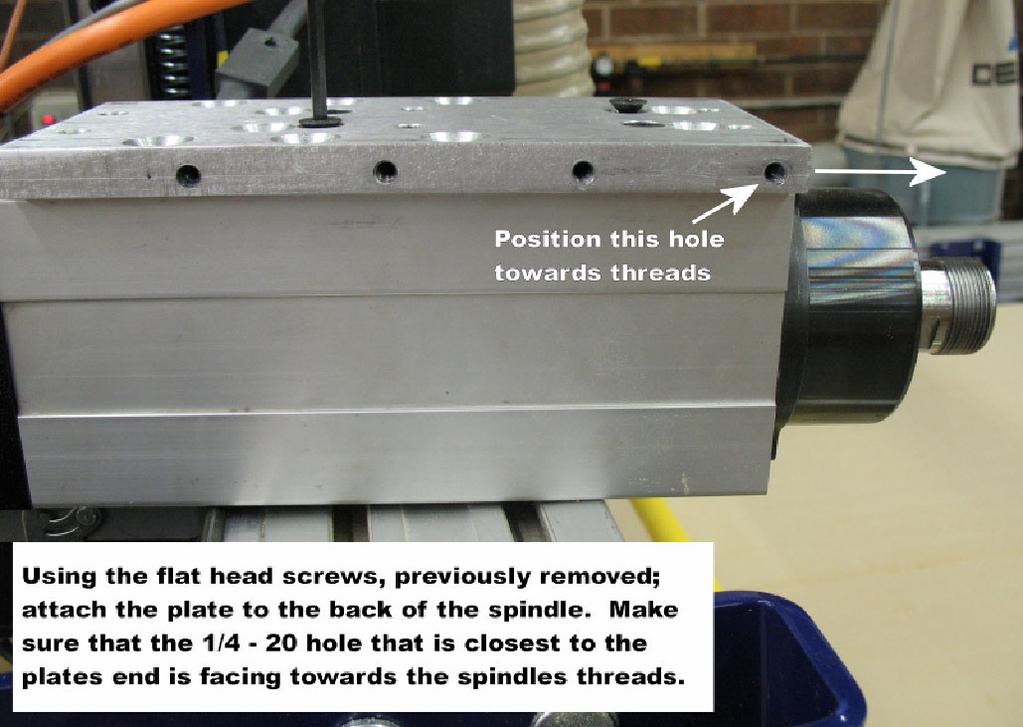 Take the spindle mounting plate with the 1/4-20 holes on the edge (SB# 001620) and attach the plate to the back of the spindle using the flat head
