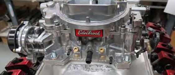 Install the carb gasket and the carb onto the manifold so that the Edelbrock logo on the