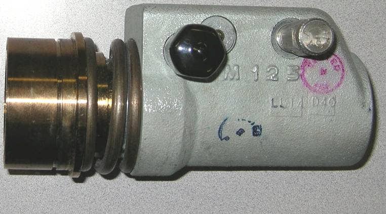 the Inlet Swing Check is no longer forced open by the Plunger, and is free to seal the flow path from the nurse tank. the Outlet Body remains with the tool bar.