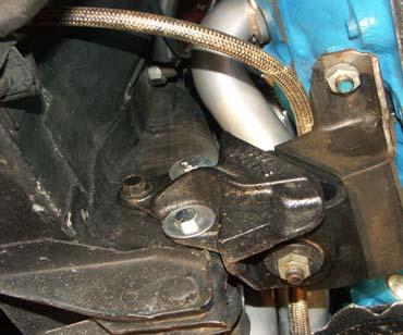 4. From under car it will be necessary to loosen motor mount nuts.