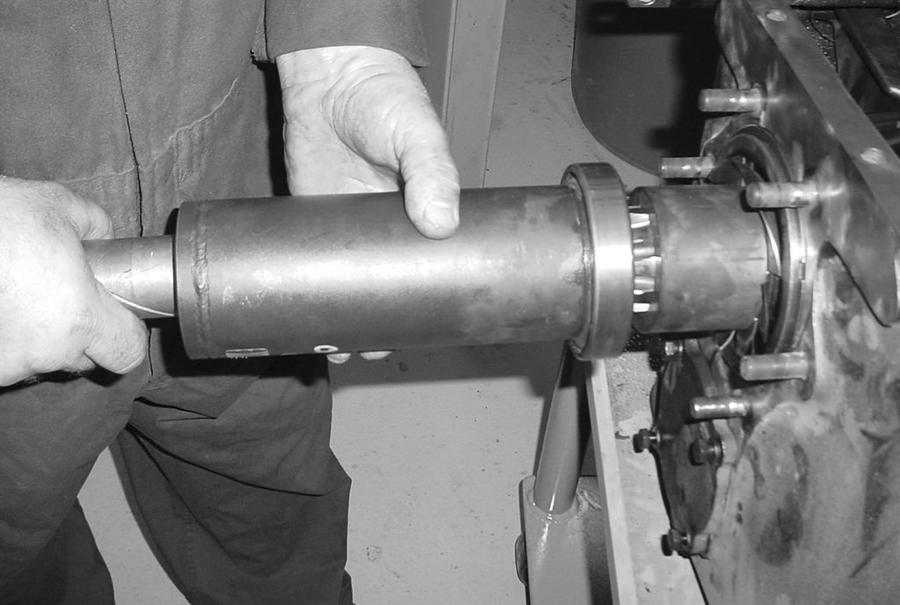 Install the oil deflector on the shaft and against the bearing with the fins toward the front. 3.