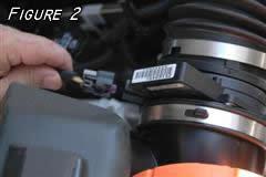 To do this you will need to remove air box cover which is held in place with 4 screws.