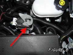 17) Remove the wiring connector shown in (figure 6) to expose the wiring loom. You will need to locate the factory fan controller wire.