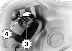7 26 z Maintenance Turn bulb socket 3 counterclockwise to remove it from the headlight housing; to do so, pivot