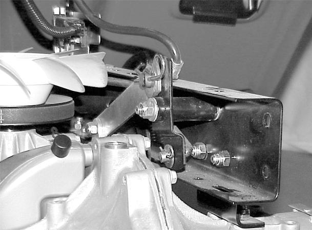 3. Reconnect the speed control link and the speed control rod with washers and hairpins (Figure 131). 5. Adjust and tighten both the right and left engine belt guides.