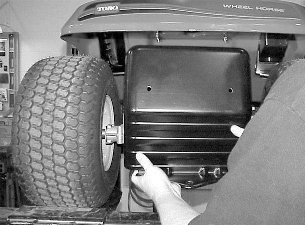 3. Remove the rear hitch panel. There are 2 bolts and nuts holding the seat springs and 2 bolts and nuts on each side of the rear panel (Figure 73). 5.