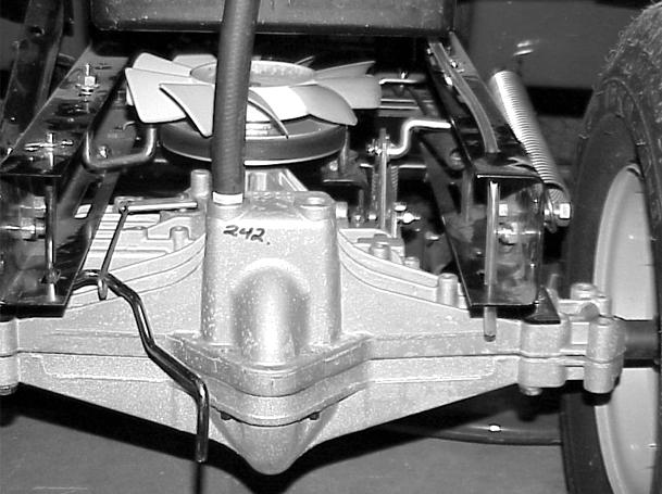13. Install the battery and battery tray. Note: If the battery uses a drain tube, make sure the tube is reinstalled through the rear hole in the frame (Figure 97). 17.