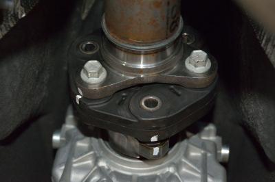 Re-install the front end of the driveshaft. Do not forget to align the driveshaft flex coupling to the transmission flange prior to inserting the bolts.