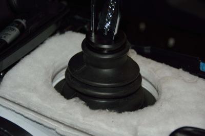 STEP 61. Install the rubber boot over shifter assembly.