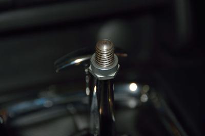 Align the logo on the shift knob accordingly and tighten the jam nut up against the