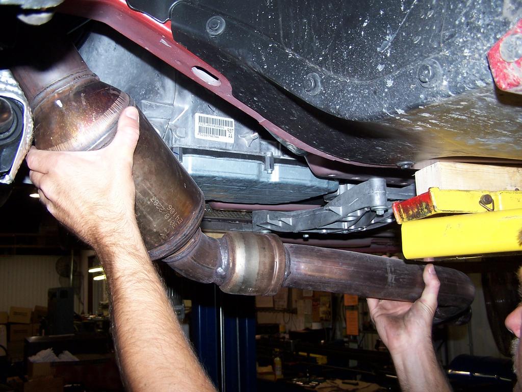 As the unit clears the studs pull the converter assembly forward and out of the muffler inlet