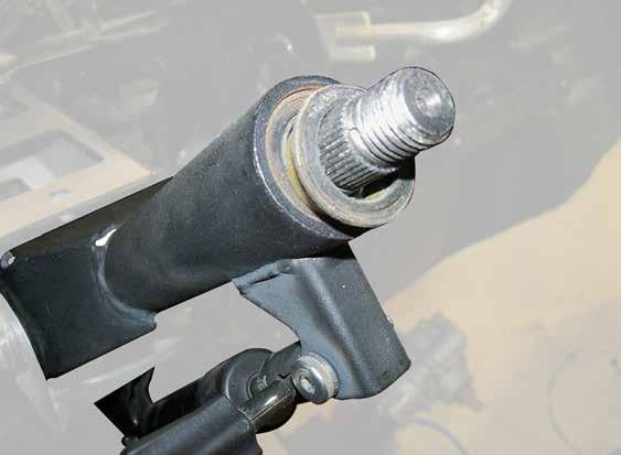 Unbolt Stock Shaft from Steering Rack. See Fig. 2.
