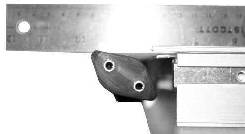 On the same side of conveyor, remove two () fastening screws (Figure 50,