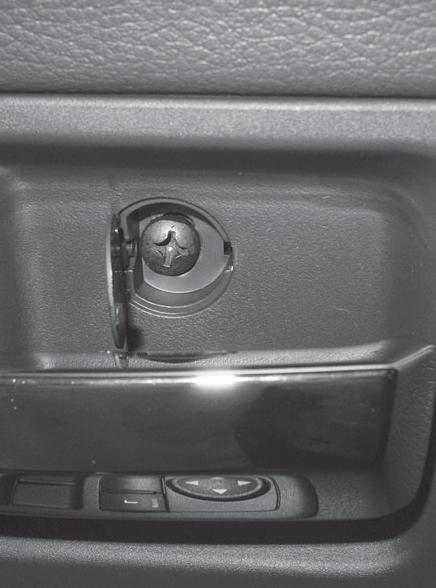 If equipped with power windows: Pry up power options switch panel to release clip,