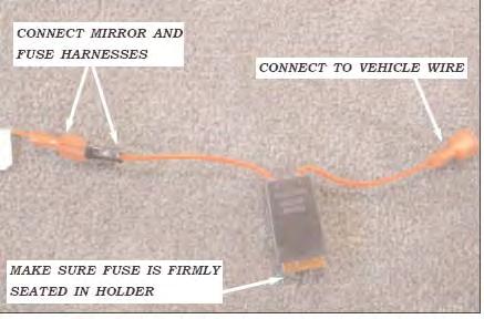 USE THE FACTORY WIRE CHANNELS AND RETAINING CLIPS. ROUTE THE HARNESS ALONG THE FLOOR UNDER THE LEFT REAR TRIM PANELS AND UP THE LEFT D-PILLAR ABOVE THE HEADLINER TO THE REAR DOOR HOSE GROMMET.