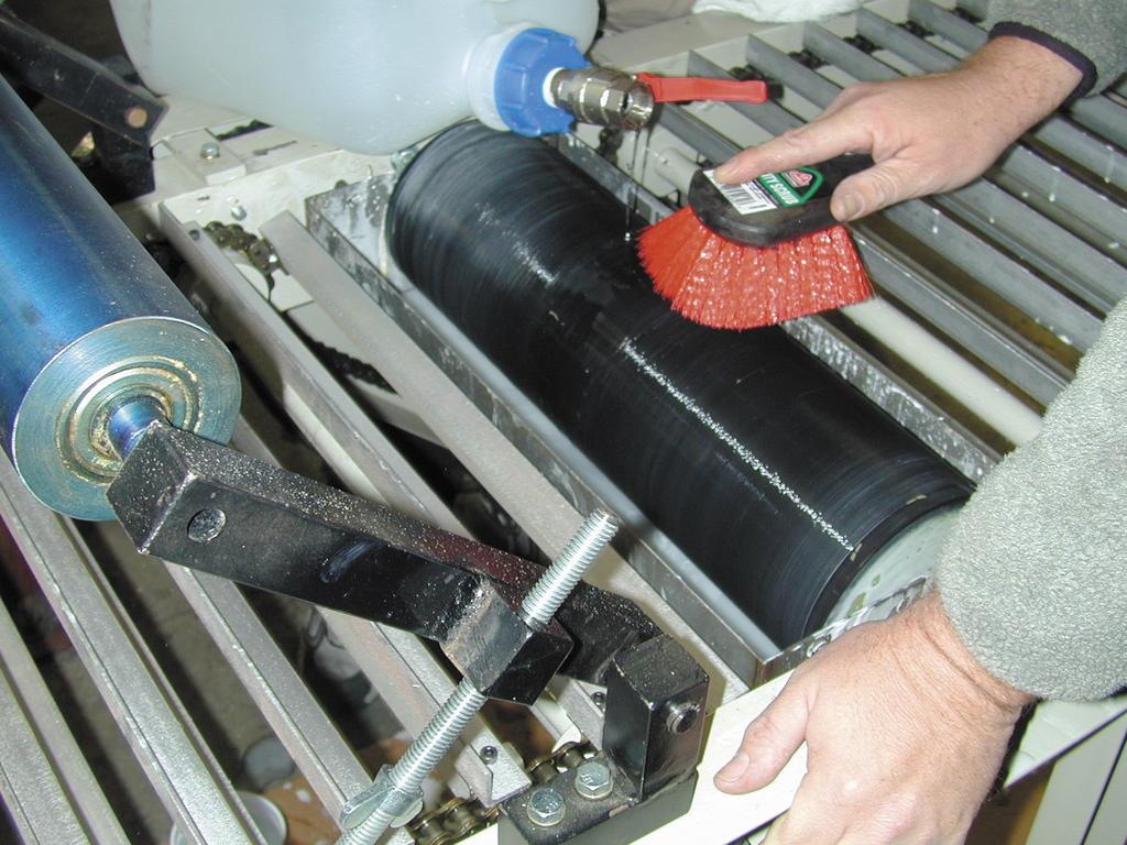 Operation 6. Place stock on the infeed of the conveyor. 7. The stock is automatically conveyed over the glue roll, where glue is applied to the underside of the stock.