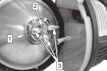 4. Remove the spring clip (1) and pull the bulb (2) out of the reflector. 5 Hold the new bulb (Part number AURWL1004) using a lint free cloth and install it by reversing the procedure above. Fig.