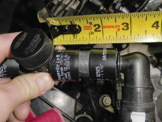 Add a provided shrink clamp (shown with the yellow arrow) to the hose and install the provided filler T. Then add the provided 2.