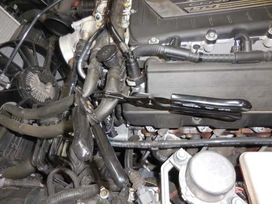 9. Here you can see the serpentine belt wrench attached to the tensioner.