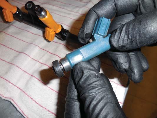 Install a light coat of spindle oil or gasoline to the O-ring on the top of each new injector.