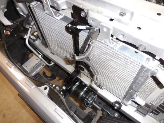 173. Install the new hood support bracket with the original fasteners.