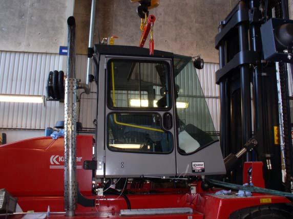 a) b) Figure : The experimental setup in a) the cabin of the fork-lift truck and in b) the microphones and loudspeakers mounted in the cabin. configured for two loudspeakers and 4 error microphones.