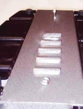 Loosening foot channels allow the chassis to "relax" while facilitating ease of repairs. Failure to loosen foot channels may result in diffi culties with repairs and reassembling dispenser.