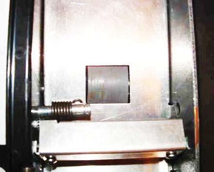 With one hand holding pinch roller and pinch roller spring, slide pinch roller shaft to the left until the pinch