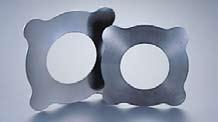 (Tungsten- Carbide) for greater wear resistance at its contact surface with bucket, reducing jerking.