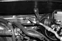 (Doing this lowers the A/C line to clear supercharger componentry.) (See Fig. 1-b.) G. Remove the factory serpentine belt H. Drain the engine coolant from the vehicle. I.