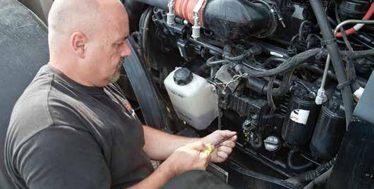 12 SERVICE AND MAINTENANCE SERVICE & MAINTENANCE There are never enough hours in the day and every minute counts. That s why all Versatile tractors are designed with easy serviceability in mind.