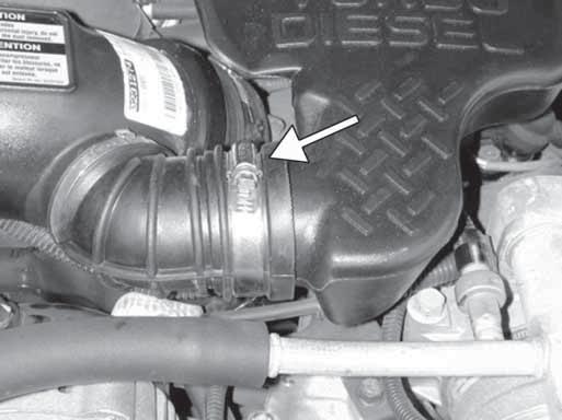 2. Removal of stock system a. On 2001 models, loosen the bolt securing the engine cover, then remove the engine cover.