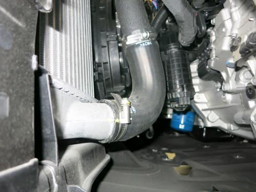 pictured above. l. Loosen the hose clamp at the lower intercooler outlet from under the vehicle.