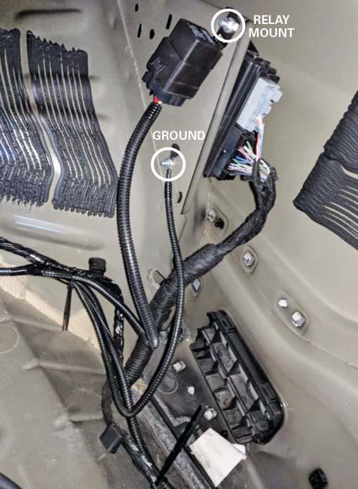 Continue routing the wiring harness along the driver side of the vehicle and secure with the standard 7" zip ties (P/N: CTUV740) as shown. 12.