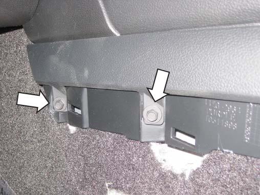 Remove the side trim pieces along the center console by lifting the front lower corners and