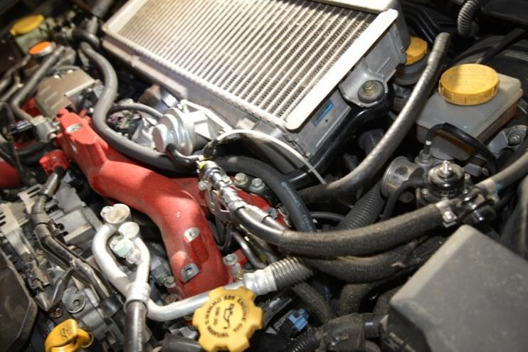 25. Use the remaining ½ PCV hose to make a connection between the left side valve cover vent port and the other branch of the Y-fitting.
