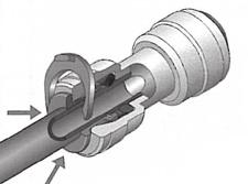 8. When disassembling the tube, push the clip in direction to the main assembly and then pull the