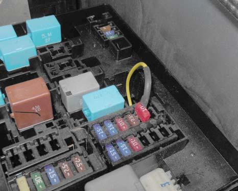 Insert the fuse which was attached to the yellow wire in the last step back into the loca- tion where the OEM 10 amp fuse