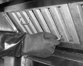 Roll the fryer carefully away from the firewall, just until the capping piece clears the filter shelf. Secure the capping piece, if there is one. Place vat covers on all vats.