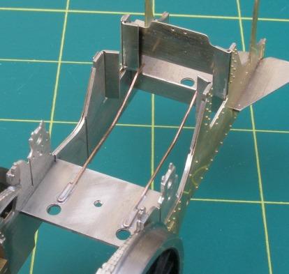 Note the slot for the pivot bracket must be at the back. Fold up the pivot bracket (B8) and solder in place. Solder the axle boxes (BR1) in place and the stretcher bars (B7).