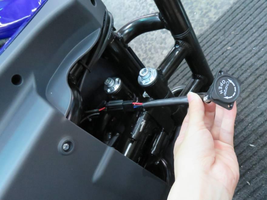 In this instance, the emergency charging cable can be installed to allow the battery to be charged whilst the scooter is folded.