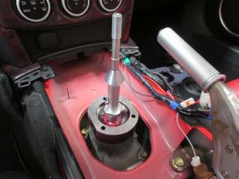 and the shifter ball should rest on top of the plastic bushing you installed.